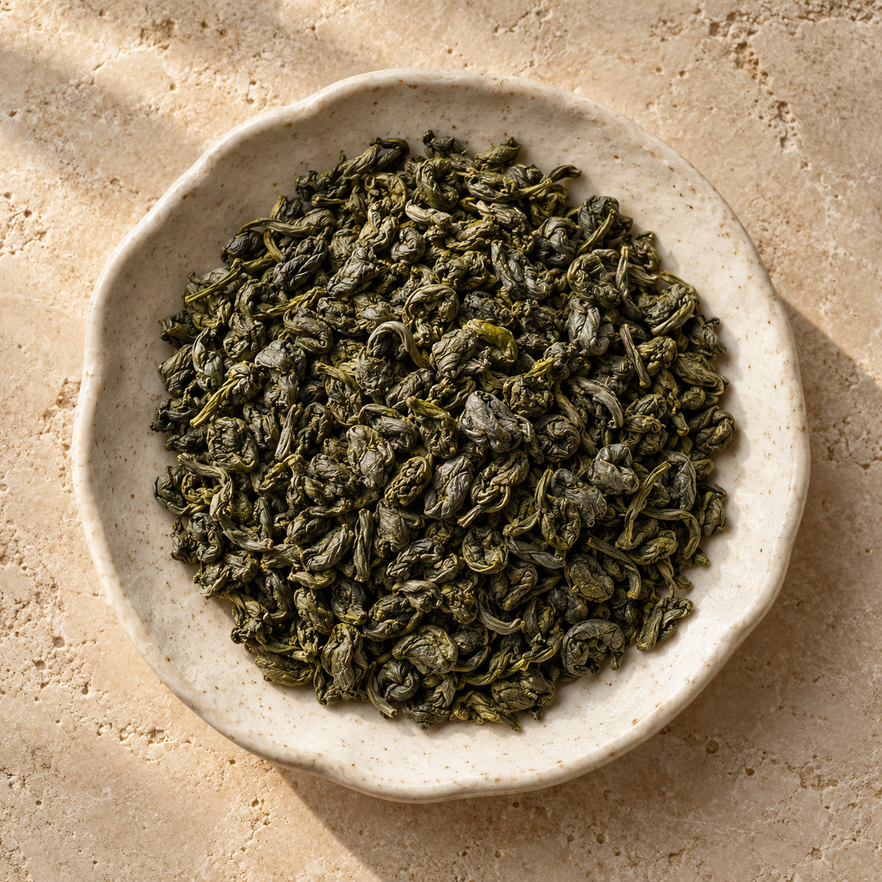 Hand crafted Ceylon green tea presented loose in a ceramic dish